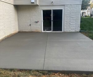 broom finis h concrete patio near Stafford- City Light Construction LLC
